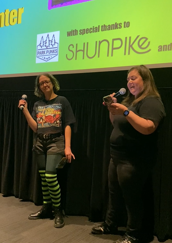 Two ParkPunks deliver a speech about the importance of art, among other things, before a film screening in Seattle